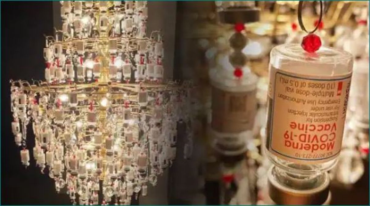 Nurse made chandelier with empty vials of corona vaccine