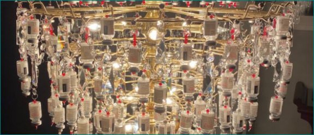 Nurse made chandelier with empty vials of corona vaccine