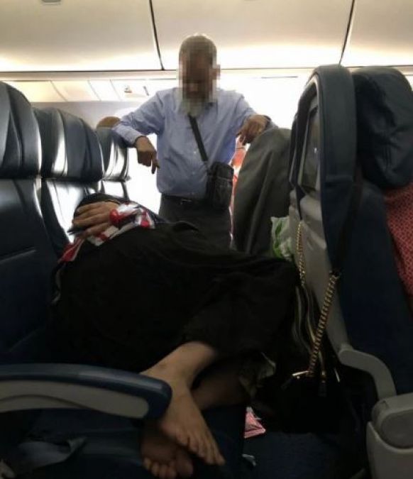 Photos: Man stands for 6 hours on flight to let wife sleep