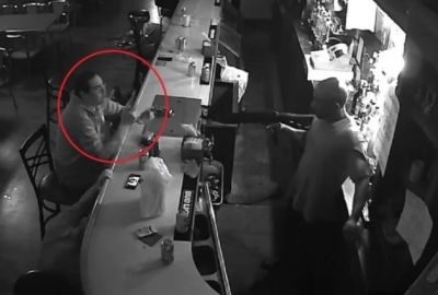 Unfazed Guy Sits And Smokes At Bar As Armed Robbery Takes Place