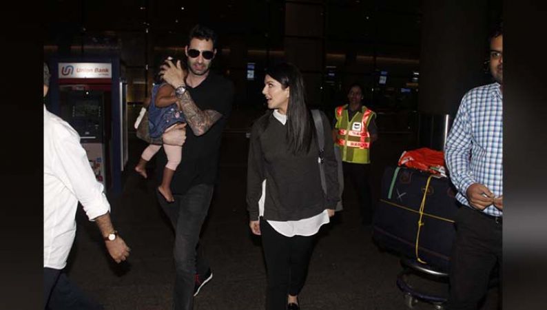 मुंबई एयरपोर्ट पति के साथ नज़र आयी सनी लियॉन, बेटी निशा भी थी साथ