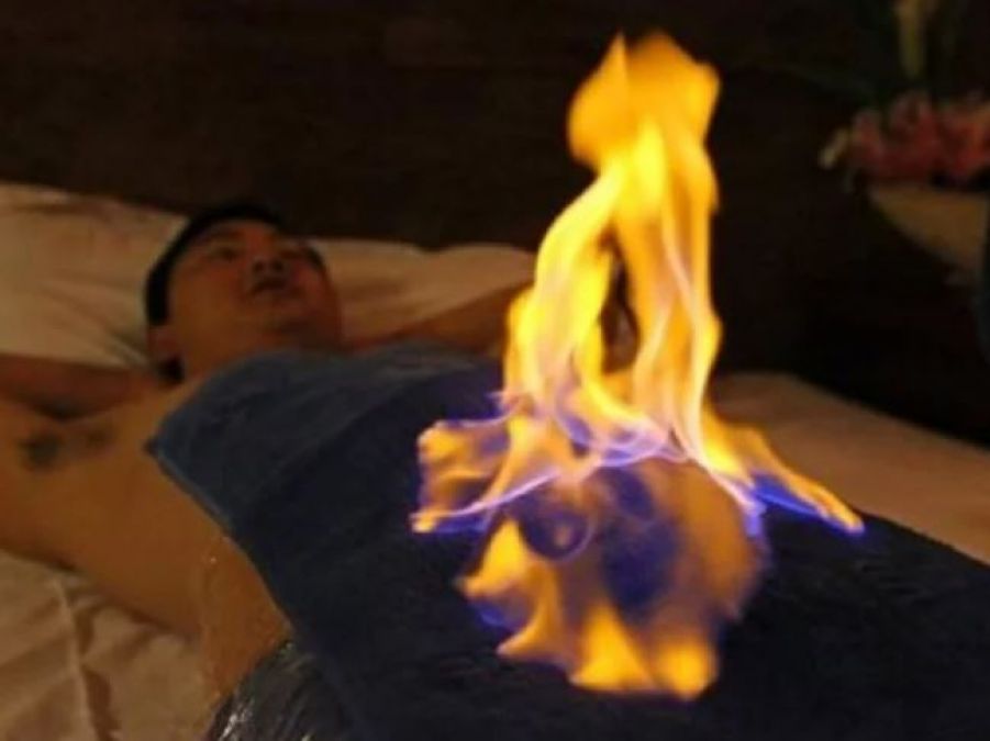 This man cures diseases by putting the patients on fire