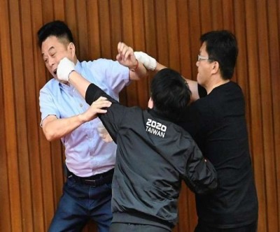 Uproar in Taiwan Parliament MPs throw water balloons at each other