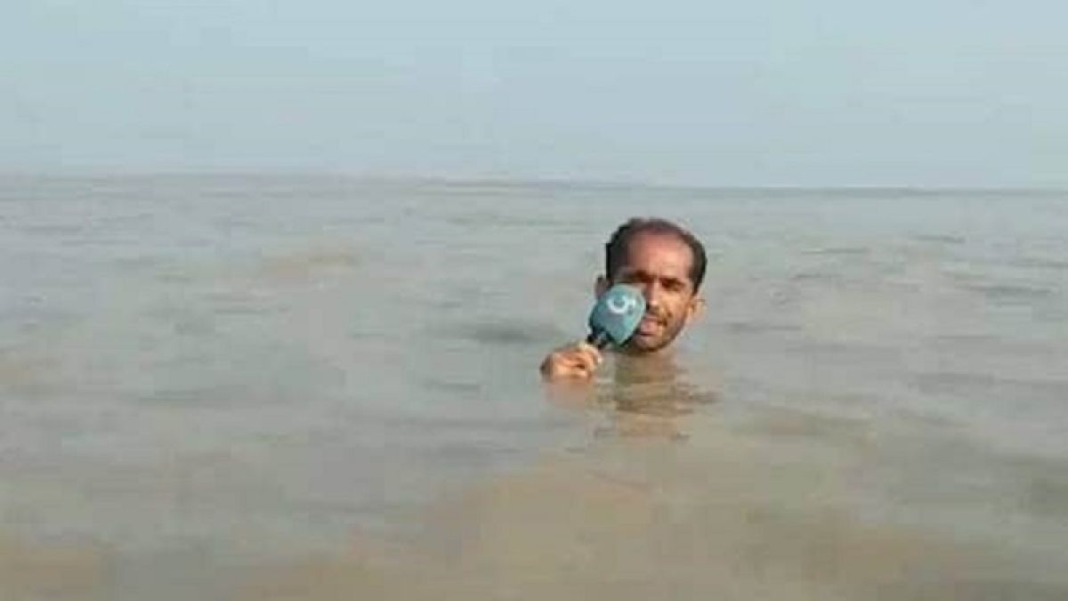 VIDEO: This reporter submerged till throat in water for reporting, got fiercely trolled on social media!